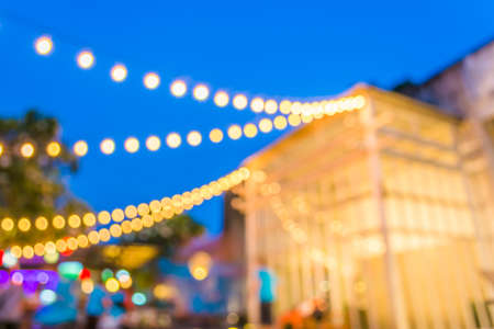 Artistic style - Defocused night street abstract texture ,blurred background with bokeh of  city on street at night.の写真素材