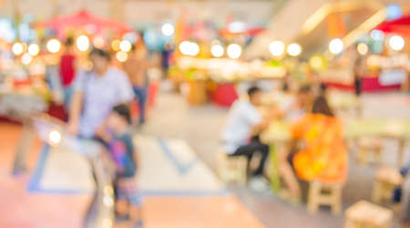 blurred image of shopping mall and people for background usage.の写真素材