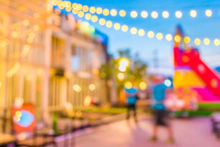 Artistic style - Defocused night street abstract texture ,blurred background with bokeh of  city on street at night.の写真素材
