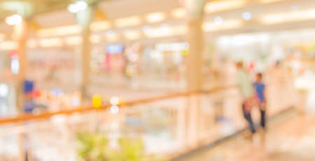 blurred image of shopping mall and people for background usage.の写真素材