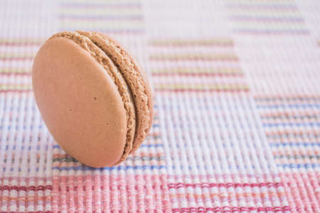Sweet and colourful french macaroons on cotton cloth background .の写真素材