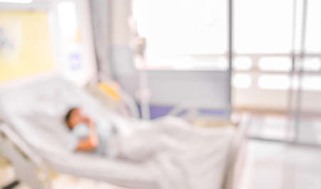 blurred image of Patient with drip in hospital for background usage.の写真素材