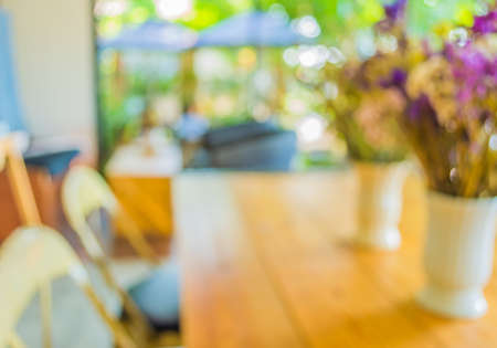 blur image of coffee shop with bokeh for bacground usage.の写真素材