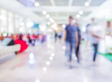 Blurred image of people walking at day market , blur background with bokeh.の写真素材