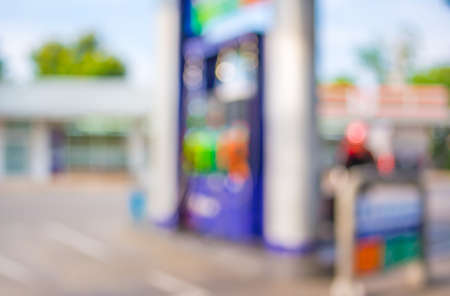 blur image of gas station on night time for background usage.の写真素材