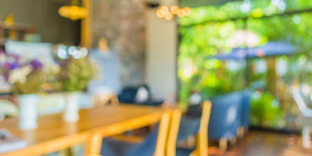 blur image of coffee shop with bokeh for bacground usage.の写真素材