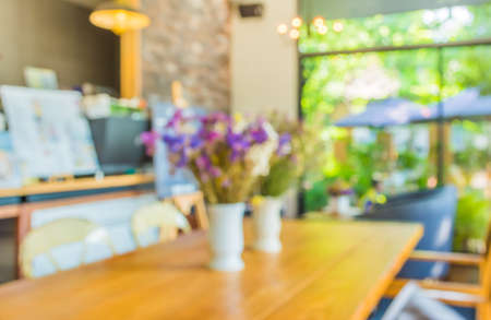 blur image of coffee shop with bokeh for bacground usage.の写真素材