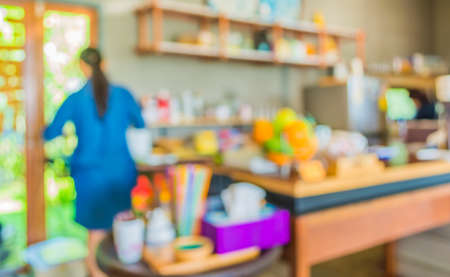 blur image of coffee shop with bokeh for bacground usage.の写真素材