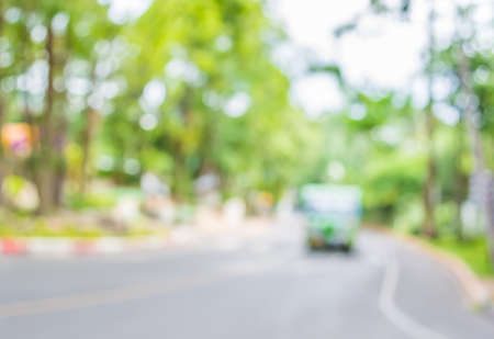 image of blur tram on the road with bokeh .の写真素材