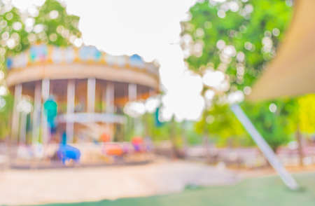 blur image of roundabout in theme park for background usage.の写真素材