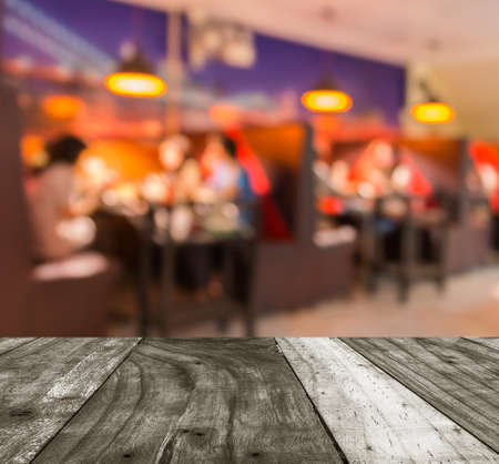 Coffee shop blur background with bokeh image .