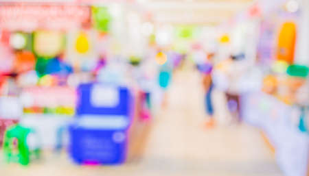 Blurred image of people walking at day market in sunny day, blur background with bokehの写真素材