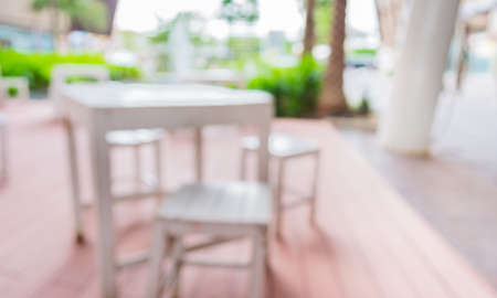 blur image of Tables and decoration prepared for an outdoor party.の写真素材