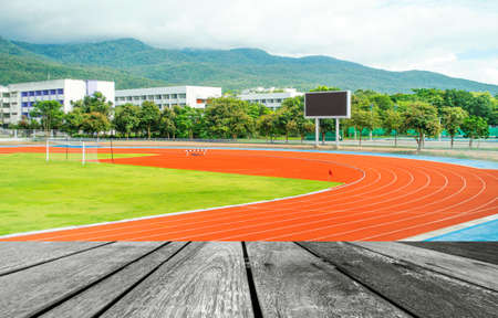 runners racetrack   surrounded by mountain in universityの写真素材