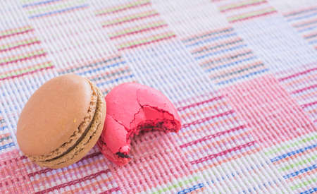 Sweet and colourful french macaroons on cotton cloth background .の写真素材