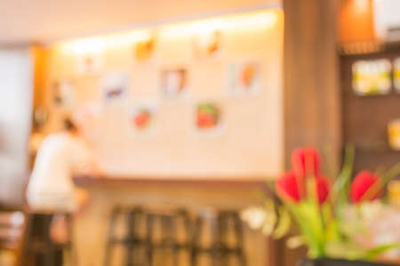 Coffee shop blur background with bokeh .