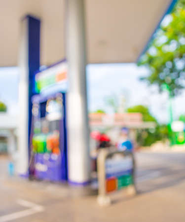 blur image of gas station on night time for background usage.の写真素材
