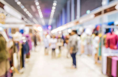 Blurred image of people walking at shopping mall , blur background with bokeh .の写真素材