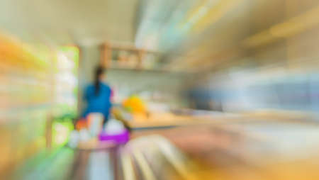 blur image of coffee shop with bokeh for bacground usage.の写真素材