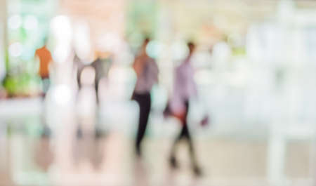 blur image of people in the lobby of a modern business center with a blurred background.の写真素材