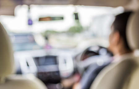 blurred image of people driving car on day time for background usage .の写真素材