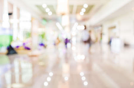 Blurred image of people walking at day market , blur background with bokeh.の写真素材