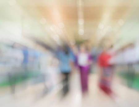 Blurred image of people walking at shopping mall , blur background with bokeh .の写真素材