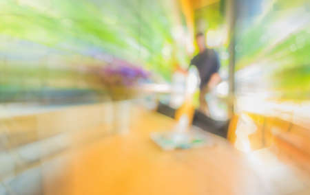 blur image of coffee shop with bokeh for bacground usage.の写真素材