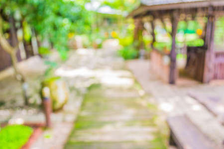 blur image of Long empty corridor with open space to the green garden with bokeh for background usage .の写真素材