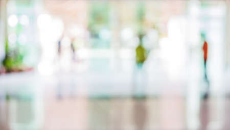 blur image of people in the lobby of a modern business center with a blurred background.の写真素材