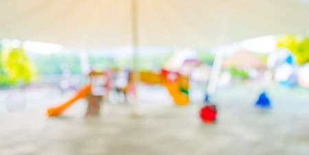 Defocused and blur image of children's playground at public park for background usage .の写真素材