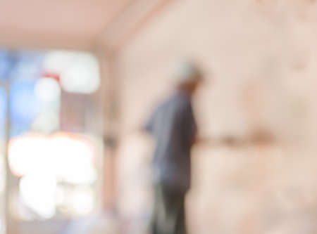 blur image of people  fixing house wall for background usage.の写真素材