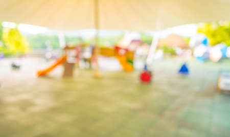Defocused and blur image of children's playground at public park for background usage .の写真素材