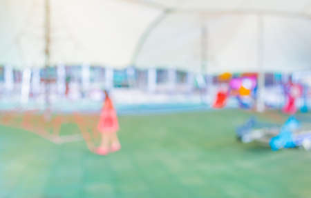 Defocused and blur image of children's playground at public park for background usage .の写真素材