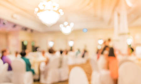 blur image of wedding party  in large hall for background usage.の写真素材