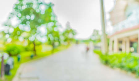 blur image of Long empty corridor with open space to the green garden with bokeh for background...