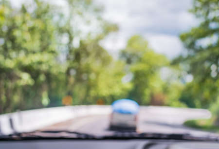 blur image of inside cars to see the road  with bokeh lights for background usage.