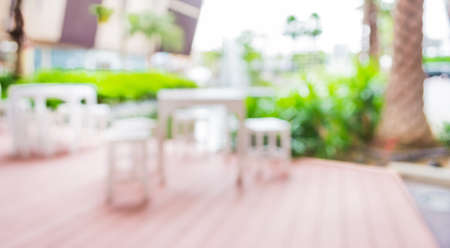 blur image of Tables and decoration prepared for an outdoor party.の写真素材