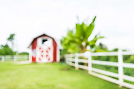 image of blur  barn and green field for background usage .の写真素材