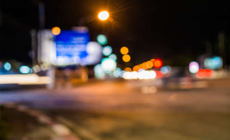 image of blur street  bokeh  with warm colorful lights in night time for background usage .の写真素材