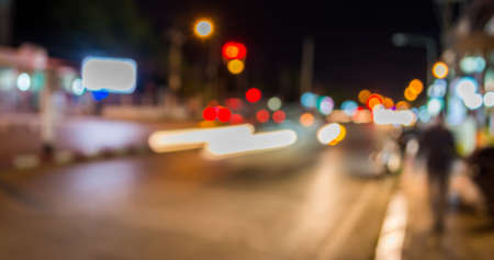 image of blur street  bokeh  with warm colorful lights in night time for background usage .の写真素材