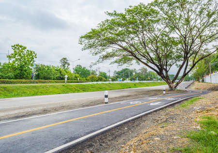 image of asphalt road and new bike lane with sign for background usage.の写真素材