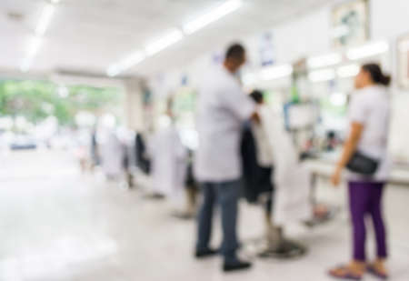 blur image of people at haircut shop for background usage.の写真素材