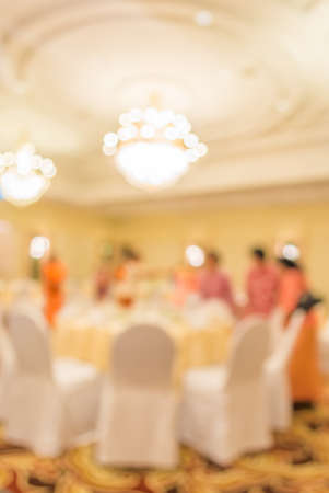 blur image of wedding party  in large hall for background usage.の写真素材