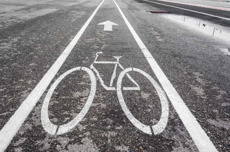 image of asphalt road and new bike lane with sign for background usage.の写真素材