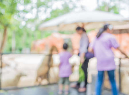 image of blur people feeding animals  with bokeh .の写真素材