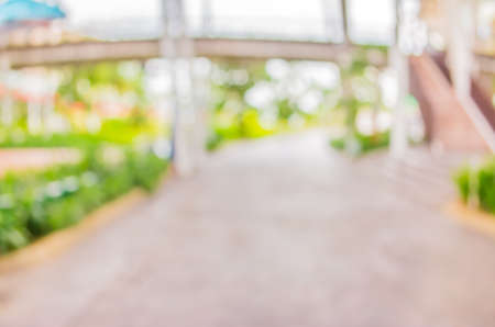 blur image of Long empty corridor with open space to the green garden with bokeh for background usage .の写真素材