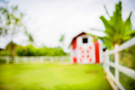 image of blur  barn and green field for background usage .の写真素材