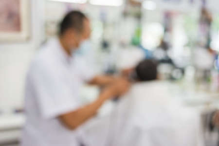 blur image of people at haircut shop for background usage.の写真素材