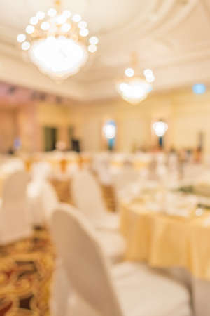 blur image of wedding party  in large hall for background usage.の写真素材